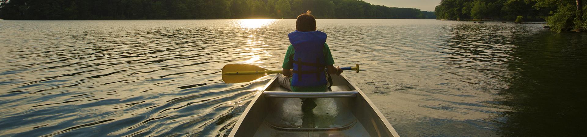 person sitting in boat